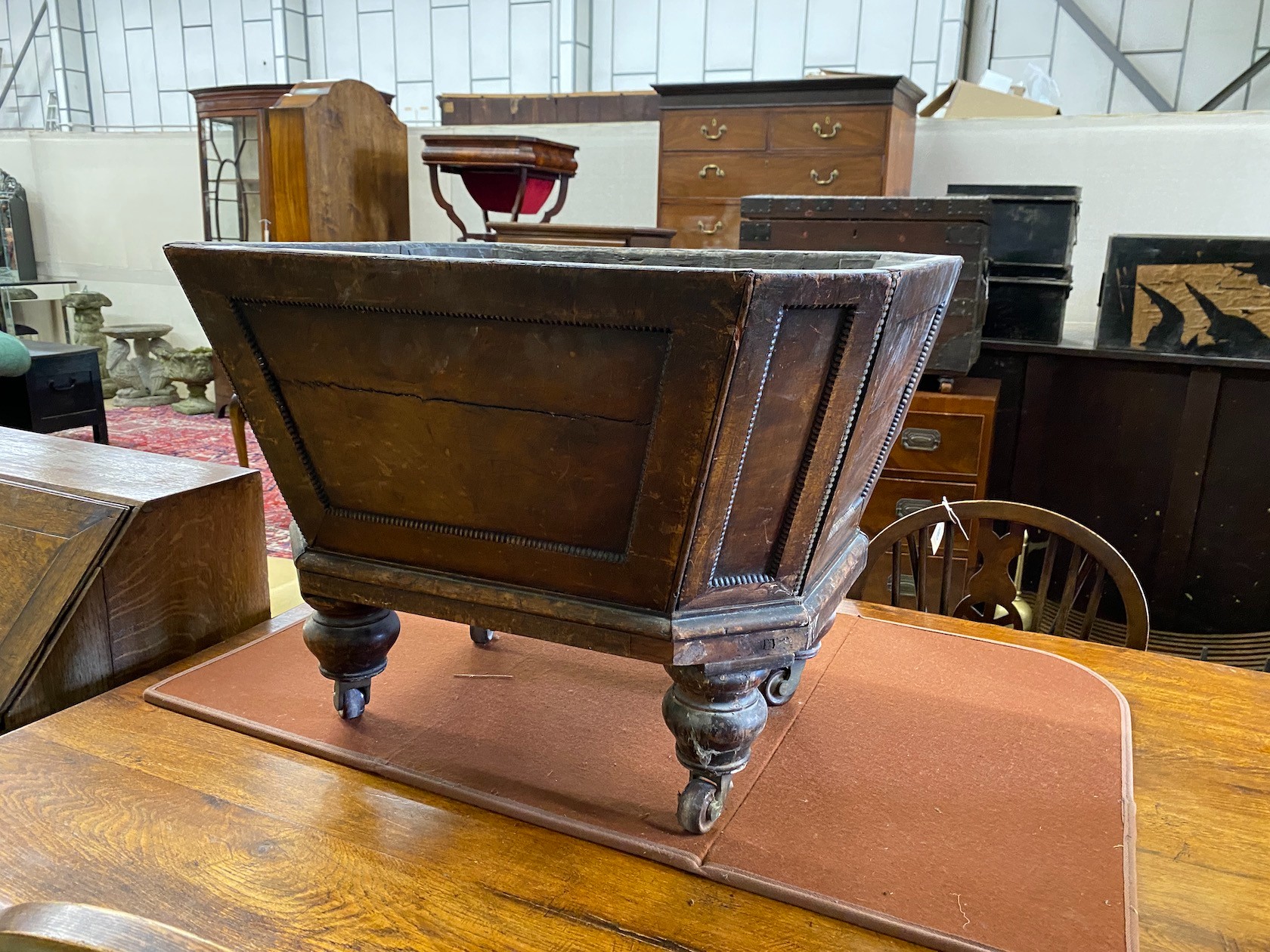 A George IV octagonal mahogany cellarette lacking cover, width 69cm, depth 54cm, height 50cm